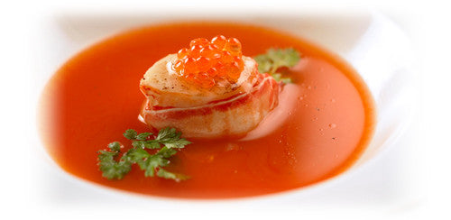 CARROT POTAGE WITH CRAYFISH MEDALLIONS AND HERB LEAVES