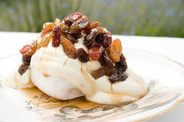 Little Pavlovas and Vanilla Crème Fraiche with Poached Raisins in Dessert Wine